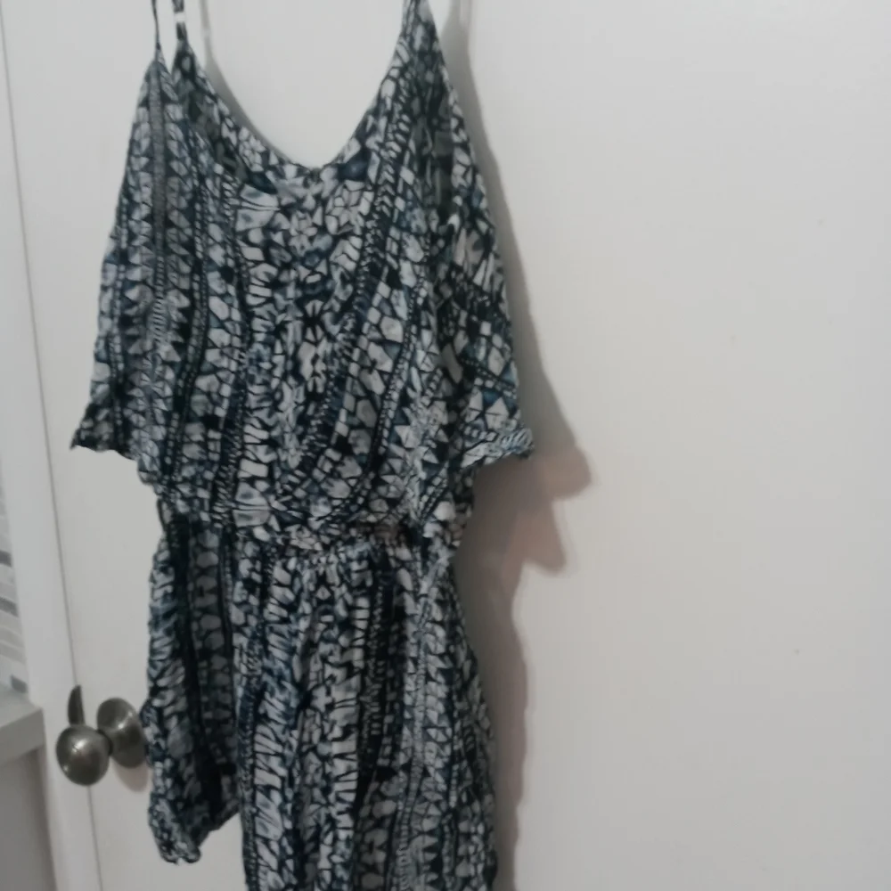 Olivaceous Sleeveless Romper. Adjustable Straps. Layered Ruffle top